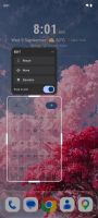 The home screen with Liquid Glass: the wallpaper is genuinely refracted through the calendar widget.