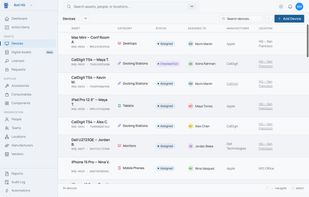 Searchable asset list showing tag, category, status, assigned owner, manufacturer, and location across hardware, accessories, and consumables.