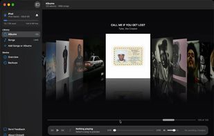Cover Flow laid out exactly as the iPod shows it: artists in alphabetical order, each artist's albums after them, compilations together at the end. Click a cover to center it, double-click to open the album.
