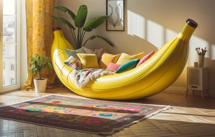 A vibrant yellow banana-shaped couch sits in a cozy living room, its curve cradling a pile of colorful cushions.  on the wooden floor, a patterned rug adds a touch of eclectic charm, and a potted plant sits in the corner, reaching towards the sunlight filtering through the window.
