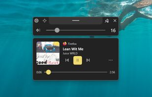 Volume flyout with the media card: album art, controls and a live timeline