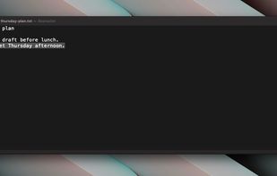 The dictated sentence after it lands in the file.