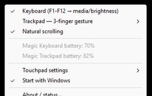Pearipherals tray menu showing enabled keyboard media/brightness mode, natural scrolling, separate Magic Keyboard and Magic Trackpad battery levels, and autostart.