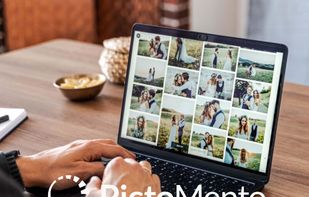Photographer managing online photo gallery on laptop with PictoMento platform