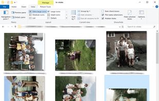 A folder of scanned photos before processing, showing a mix of upright, sideways, and upside-down images that would normally need to be corrected manually.