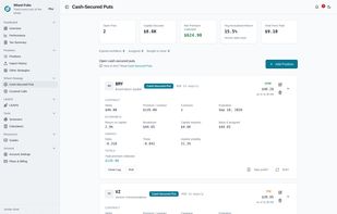 Cash-secured puts. Shows the two things that sell the app: company names against tickers, and the live price with the OTM (green) / ITM (amber) assignment-risk badge. Greeks, breakeven, capital required and basis-if-assigned are all on the card, plus the "Take profit?" / "Roll?" shortcuts into the calculators.